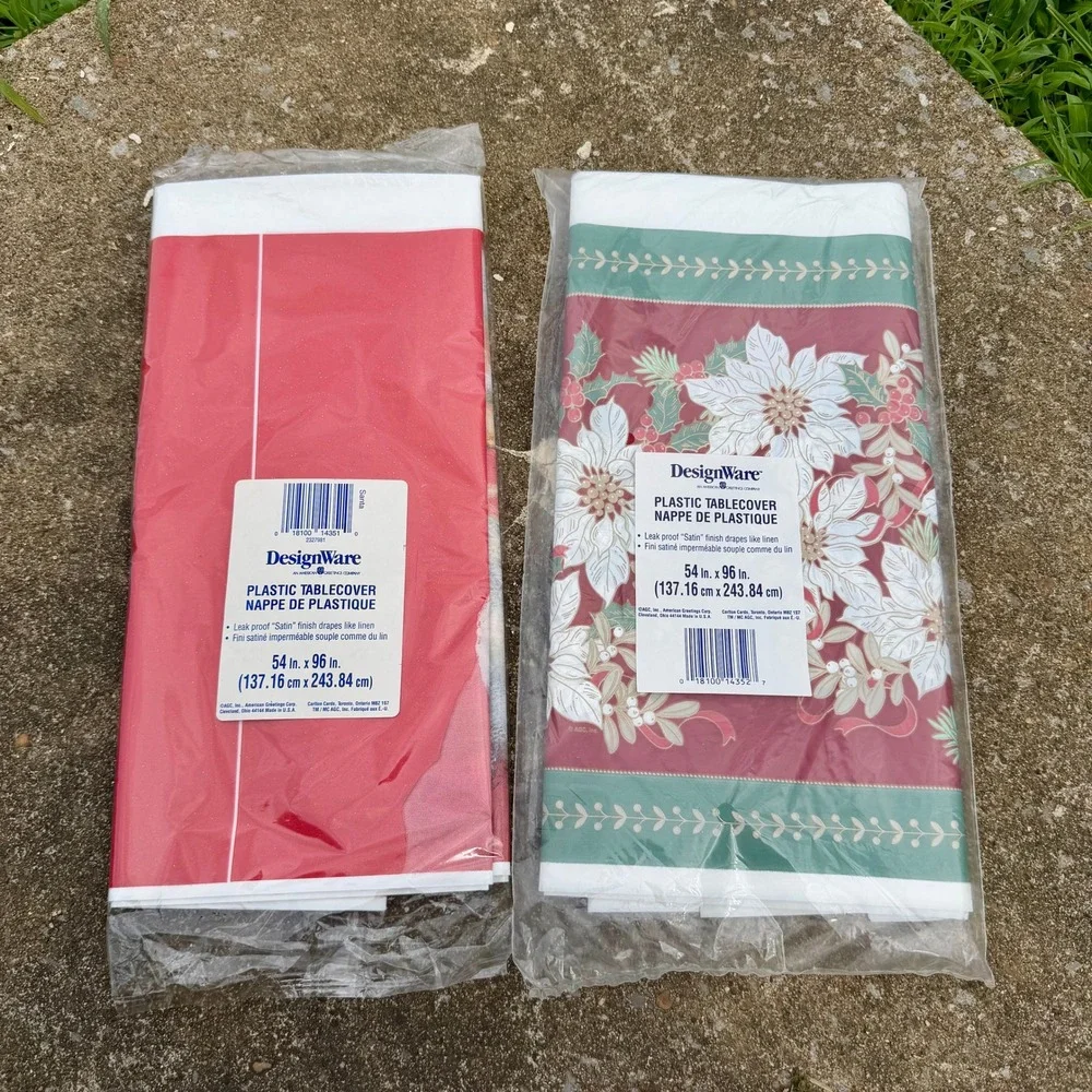 VTG Lot of 2 DesignWare Christmas Plastic Tablecloths Santa Poinsettia 54x96 New